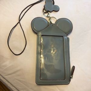Disney phone holder with lanyard. Never used.